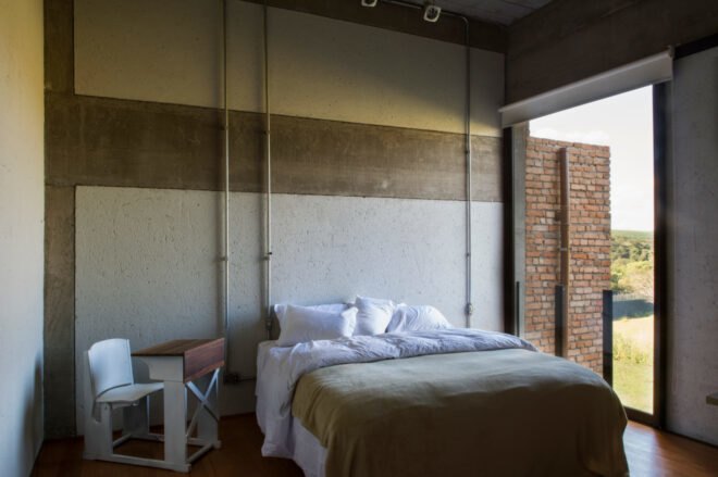 bedroom with tubes running down the wall