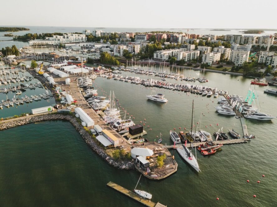 marina with multiple boats and tiny floating home