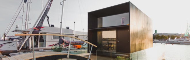 cube-like tiny home set on floating platform