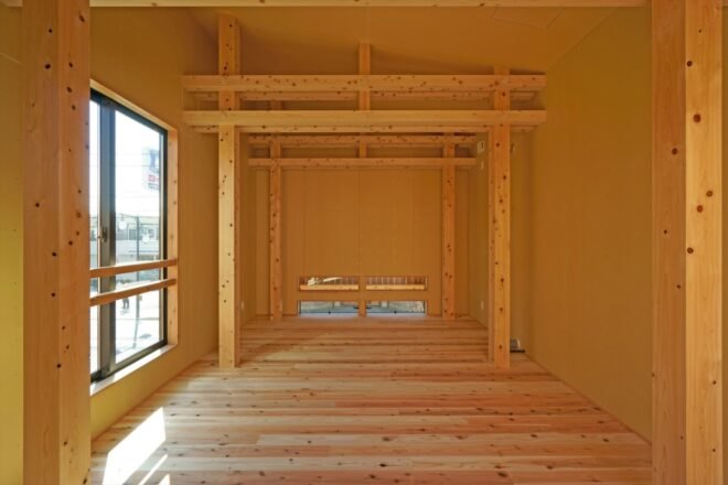 room with wood floors and wood beams and columns