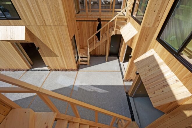 aerial view of wood buildings built around a small courtyard