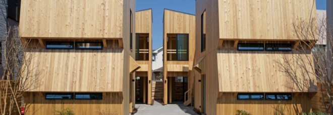 twin wooden buildings with sloped roofs