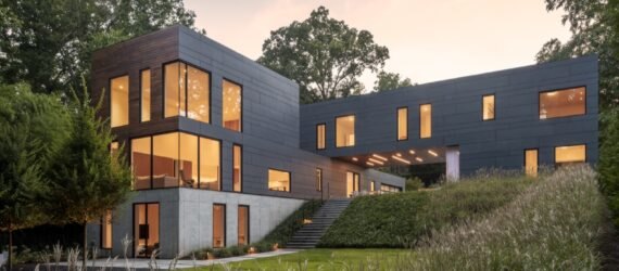 gray home with two perpendicular volumes
