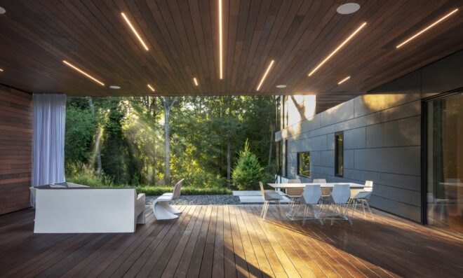 outdoor patio with white furnishings and recessed lighting