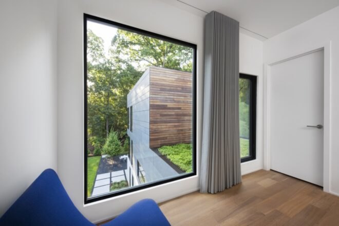 white room with large glass windows