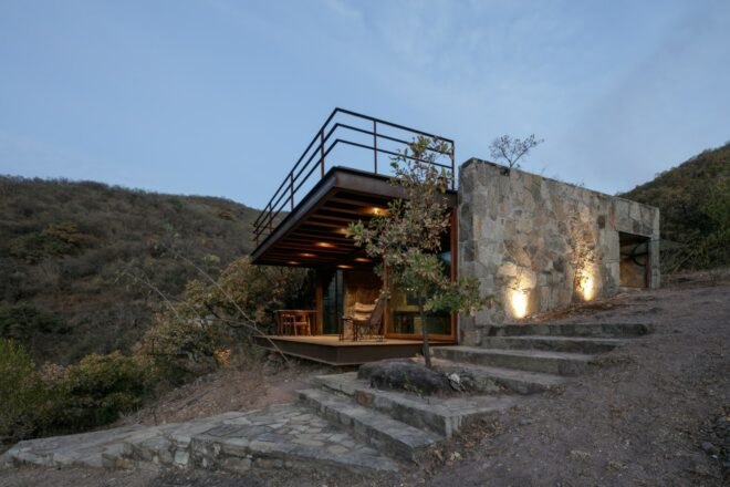 square cabin clad in natural stone