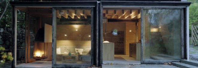 wooden cabin in Swedish countryside surrounded by greenery