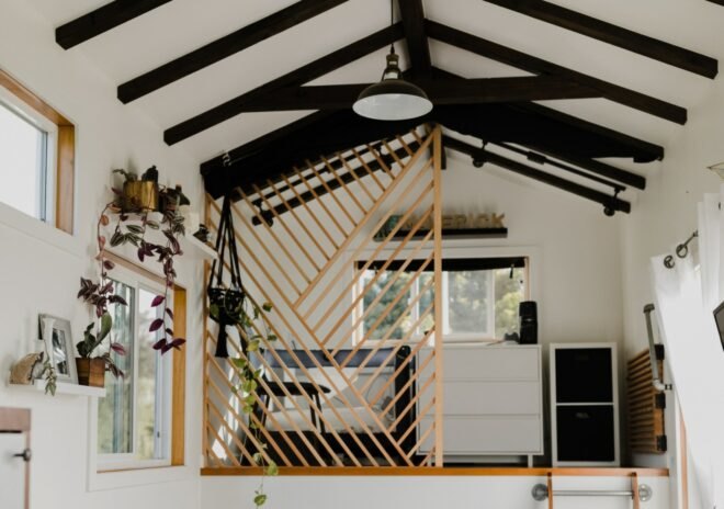 interior living space with all white walls and exposed ceiling beams