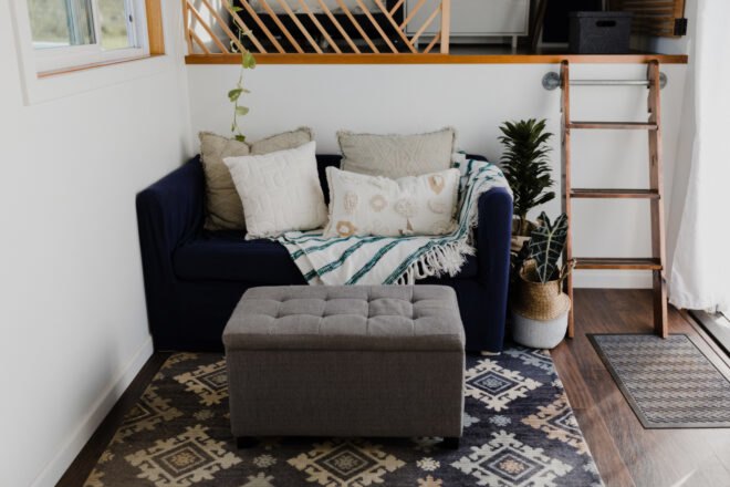 interior living space with all white walls and small sofa