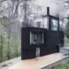 triangular charred timber home in forest