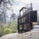 triangular charred timber home in forest