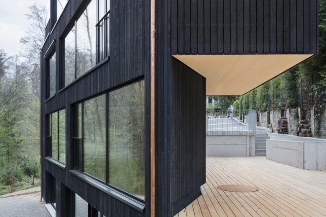triangular charred timber home in forest