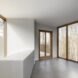 interior of home with white walls and large windows