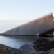 long gray building partially built underwater