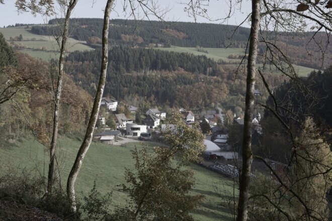aerial view of neighborhood of gabled homes and one round home