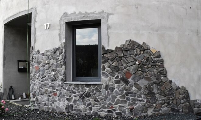 close-up of local stones on a white round building