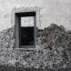 close-up of local stones on a white round building