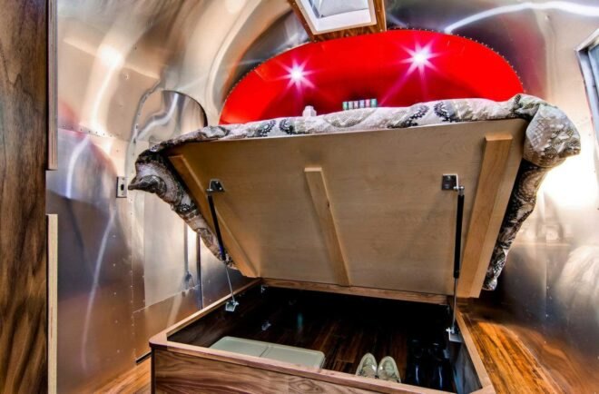 A bed lifted to reveal storage underneath