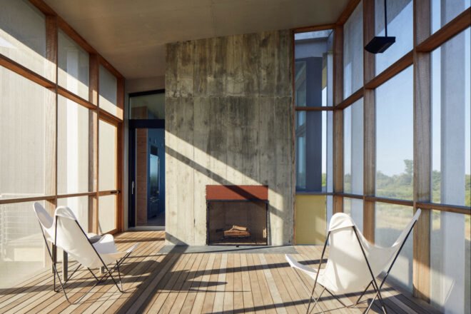 living room with two white chairs and fireplace