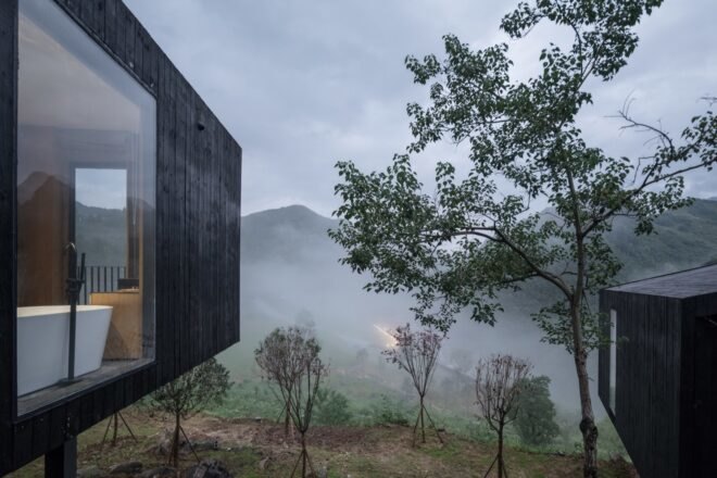 view of mountains from a black cabin