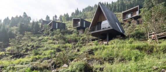 black cabins on a hillside