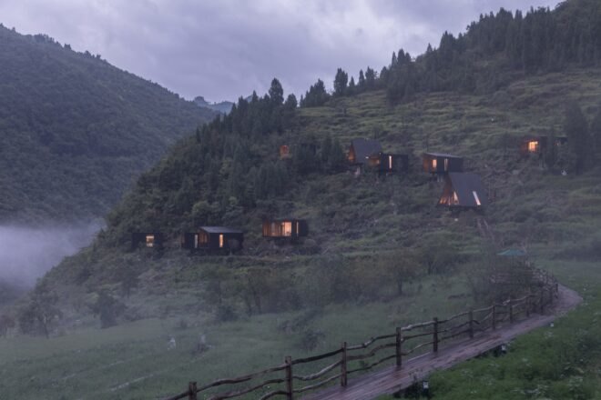 small trail leading to several small black cabins