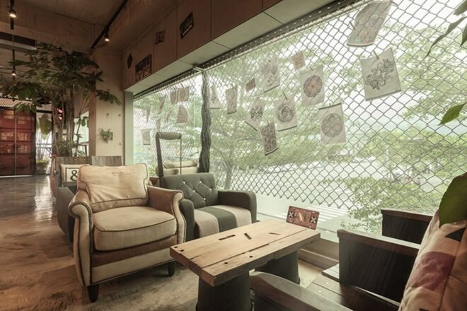 two chairs next to a large window