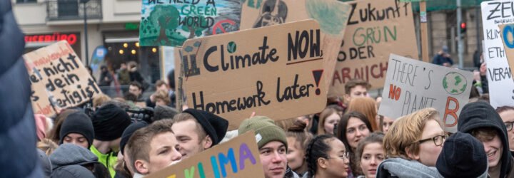 students protesting holding signs