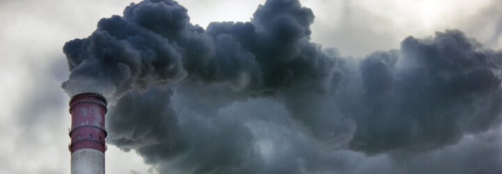 air pollution flowing out of red and white tower