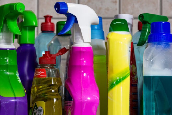 colorful plastic cleaning products on a counter