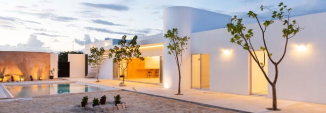 all-white home with cylindrical volumes