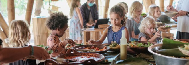 students eat fresh fruits and vegetables