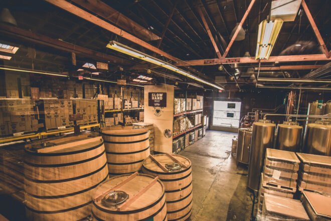large production room with whiskey barrels