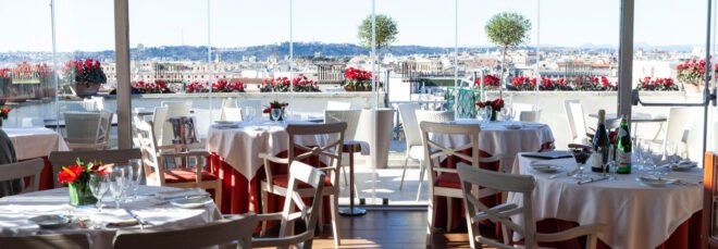 restaurant with white tables and glass walls