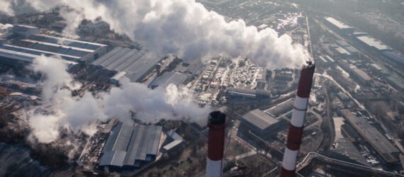 plant with smoke drifting into city's air