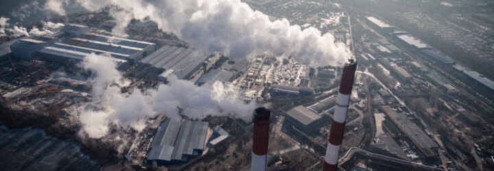 plant with smoke drifting into city's air