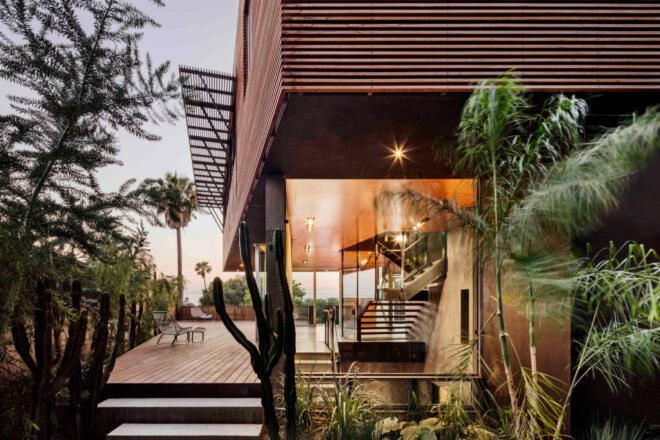 wood patio off of a glass and wood house