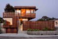 tall home with wood screens