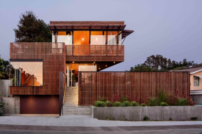 tall home with wood screens