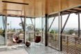 room with glass walls and two chairs