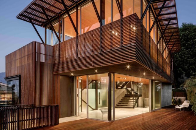 home with wooden screens and glass walls