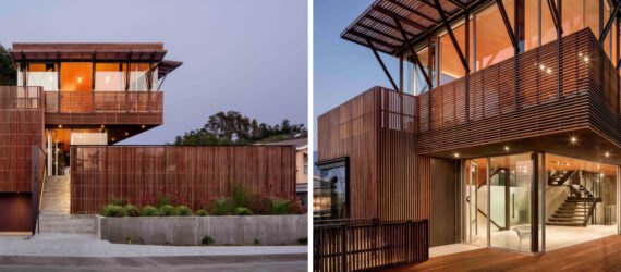 Tall, staggered home with glass walls and wooden screens