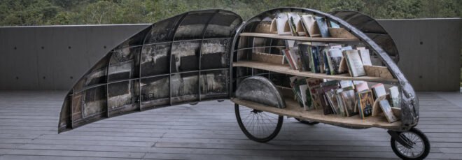 micro library on wheels in the shape of a beetle