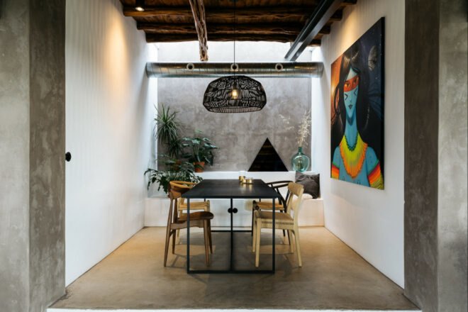 dining area with large artwork on the walls