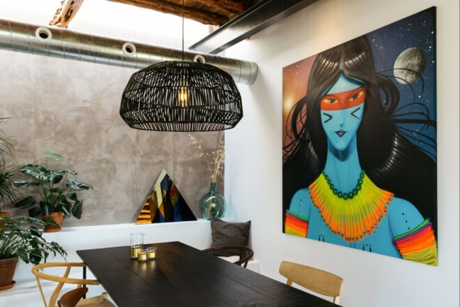 dining area with large artwork on the walls
