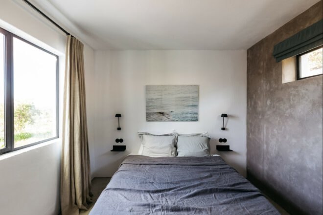 white bedroom with gray bed