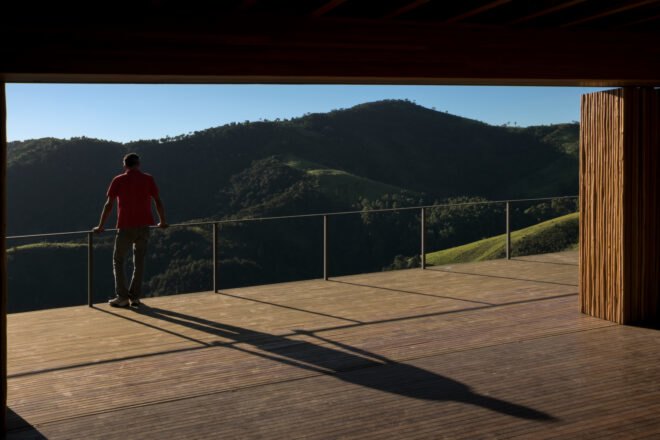mountainous views from a large wooden deck