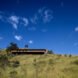 long wood home at the top of a hill
