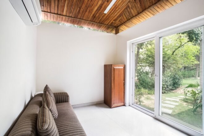 brown sofa facing sliding glass door