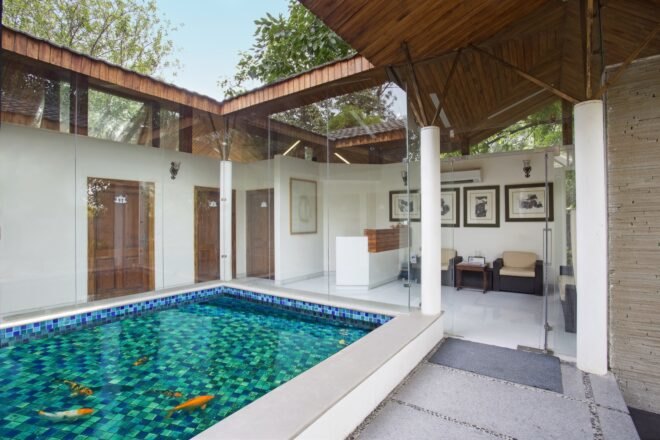 square fishpond enclosed in glass under a skylight
